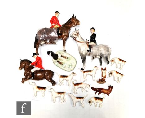 A Beswick fox hunting group comprising Huntsman (on rearing horse) model 868, Huntsman model 1501, Huntswoman model 1730, two