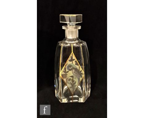 A 1930s Art Deco clear crystal decanter of faceted triangular form, decorated with an acid cut diamond panel with a parrot am