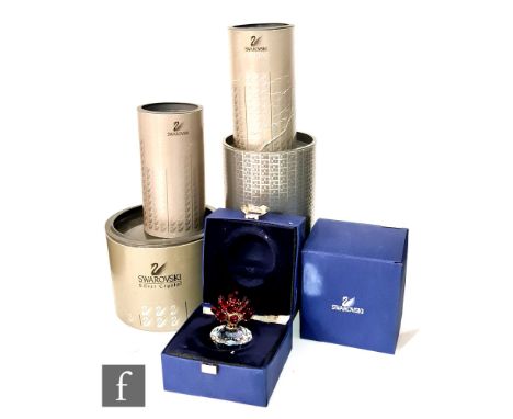 A group of Swarovski ornaments comprising, piano and stool, lute, harp, table bell and vase of roses, all in original boxes a