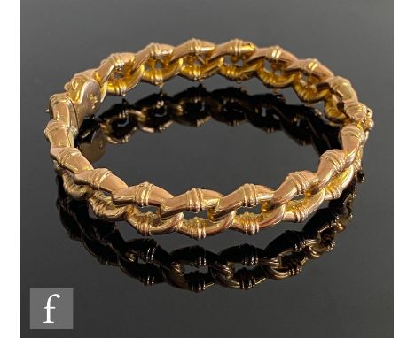 A 9ct hallmarked rose gold open link hinged bangle, weight 12g, terminating the tongue and box fastener, Birmingham 1898, S/D