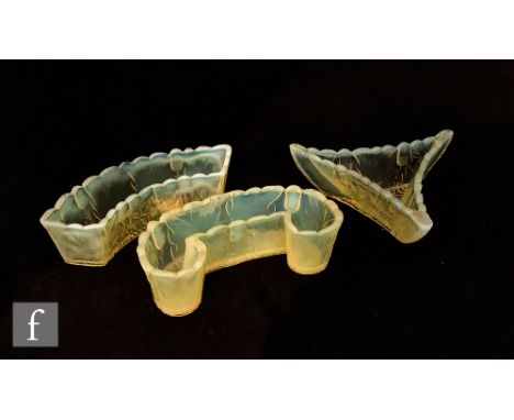 A late 19th Century Burtles &amp; Tate pressed glass trough of crescent form in a graduated citron to opalescent with relief 