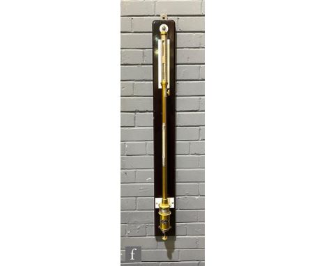 A 20th Century brass precision stick barometer by KYS, No 9104, the reservoir mounted with the makers plate on an ebonised ba