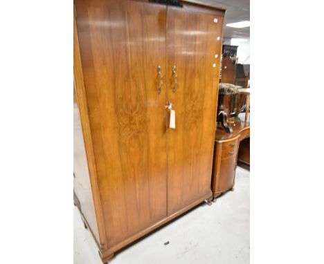A vintage walnut three piece bedroom suite