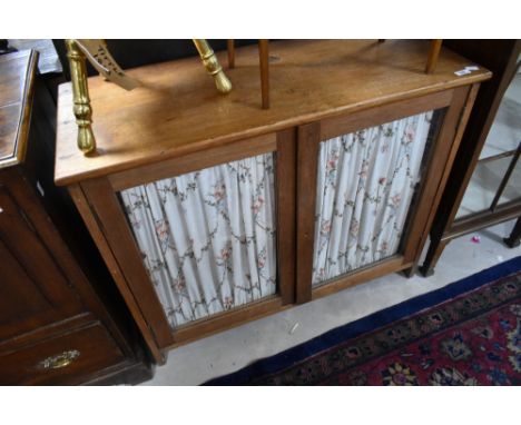 A vintage glazed cabinet base, with curtains to inner of doors, width approx. 94cm