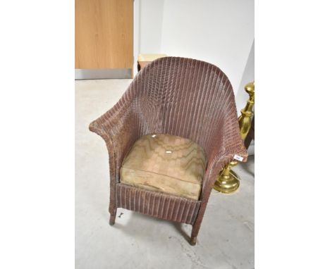 A vintage Lloyd Loom tub chair