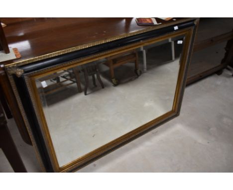 A vintage ebonised and gilt framed wall mirror, approx 79 x 108cm
