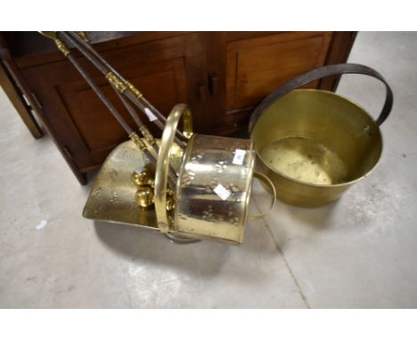 A brass jam pan , coal helmet and selection of fire tools