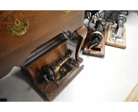 Three vintage handcrank sewing machines
