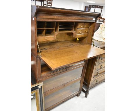 A Globe Wernicke or similar oak bookcase having three glazed tiers and bureau tier to top section (four tiers in total plus b