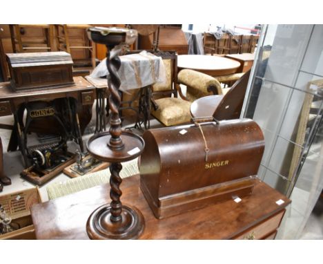 A vintage oak smokers stand and Singer sewing machine