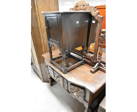 A vintage oak dressing table in the period style, and a similar bedside cupboard (some signs of worm)