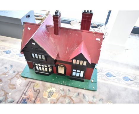 A vintage scratch built wooden dolls house
