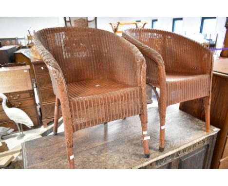 A pair of vintage Lloyd Loom tub chairs