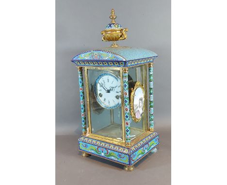 A Champleve library clock, the enamel dial with Roman and Arabic numerals with two train movement striking on a gong, 47cms t