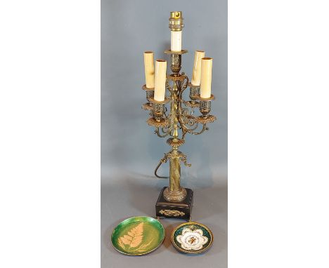 A brass four branch candelabrum, together with two small enamel dishes 