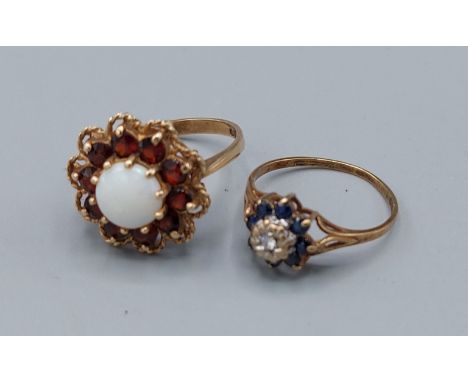 A 9ct gold opal and garnet set cluster ring, 3.8gms, ring size N together with another 9ct gold diamond and sapphire cluster 