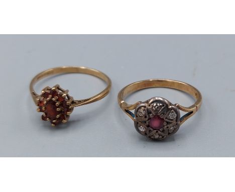 An 18ct gold diamond and ruby cluster ring, 2.6gms, ring size N together with a 9ct gold garnet set cluster ring, 1.6gms, rin