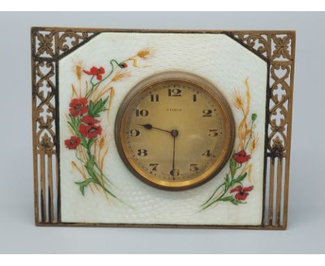 A Birmingham silver and enamel decorated table clock, with pierced decoration, the white  guilloche enamel decorated with pop
