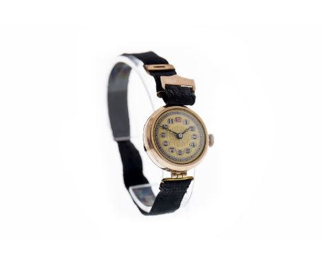 LADY'S EARLY TWENTIETH CENTURY NINE CARAT GOLD MANUAL WIND WRIST WATCH, unsigned 8 jewel movement, the round dial with Arabic