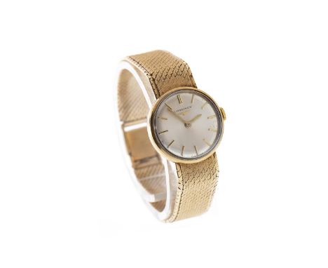 LADY'S LONGINES NINE CARAT GOLD MANUAL WIND WRIST WATCH, signed Longines movement, the silver coloured dial with applied gold