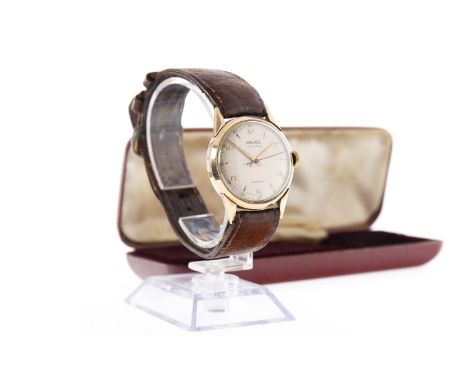 GENTLEMAN'S MAJEX NINE CARAT GOLD MANUAL WIND WRIST WATCH, the round cream dial with applied wedge and Arabic hour markers, o