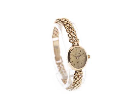 LADY'S GENEVE NINE CARAT GOLD QUARTZ WRIST WATCH, the oval dial with applied gold baton hour markers, gold pencil hands, on a
