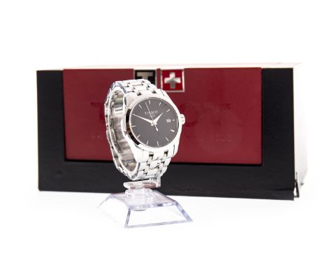 TISSOT STAINLESS STEEL QUARTZ WRIST WATCH, the round black dial with applied wedge hour markers, date aperture at 3, 34mm cas