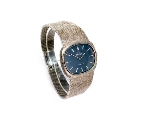 LADY'S OMEGA GENEVE EIGHTEEN CARAT WHITE GOLD MANUAL WIND WRIST WATCH, the oval blue dial with applied stainless steel hour m