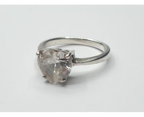 Silver ring with large Zirconia heart solitaire in faceted form with a four claw setting. 925 silver, size R 