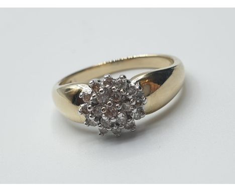 14ct yellow gold diamond cluster ring. weight 3g with  0.20ct diamonds size K 