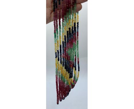 A beautiful, nine rows, of ruby, emerald and sapphire faceted beads,necklace. Approximately 1900 precious stone beads, formin