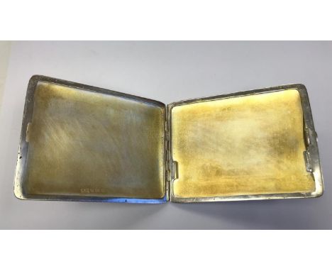 A hallmarked silver cigarette case with scene depicting Leda and the swan 