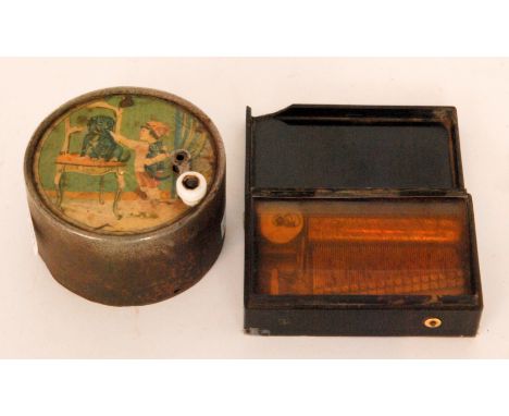 A small Maneville child's musical box with paper transfer design depicting a dog, child and kitten, together with a small rec