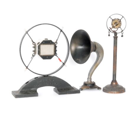 A Marconi circular desk microphone suspended in a cross frame on cast iron stand stamped Mills England, height 37cm, together