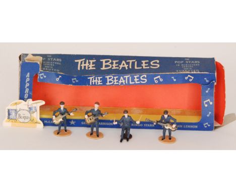 A boxed set of The Beatles by Subbuteo Pop Stars in Miniature Series, boxed with damages. 