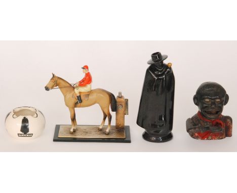 A 1950s painted table lighter modelled as a jockey on horseback with spill to the side, together with a Wade Sandemans spirit