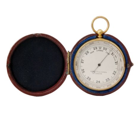 A 19th Century pocket barometer by Negretti and Zambra London with silvered dial and gold plated case in maroon outer leather