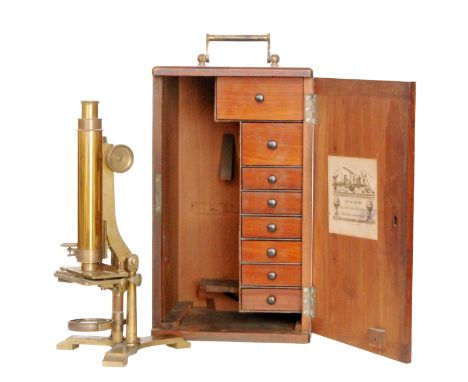 A 19th Century brass microscope by John B Dancer, Manchester with single pillar adjustment to a tricorn base together with a 