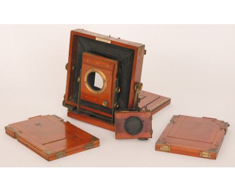 A 19th Century full plate mahogany and brass fitted camera by J Lancaster & Son, Birmingham with lens and seven plates all in