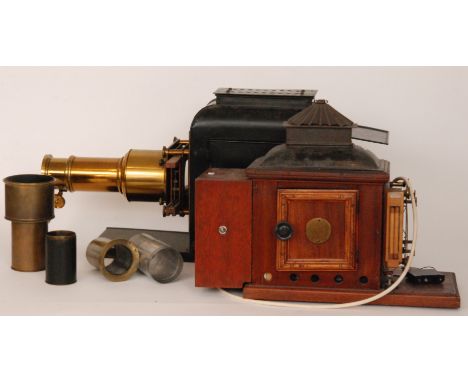 A 19th Century brass magic lantern by Newton & Co London adjustable lens in black case together with a similar lantern spares