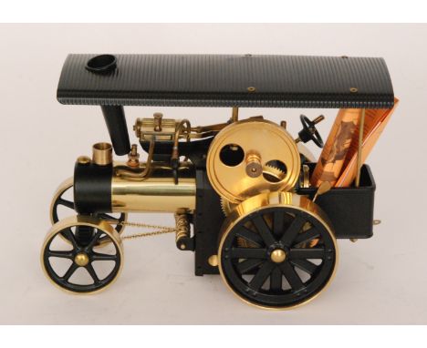 A Wilesco spirit fired traction engine, unboxed, length 30cm