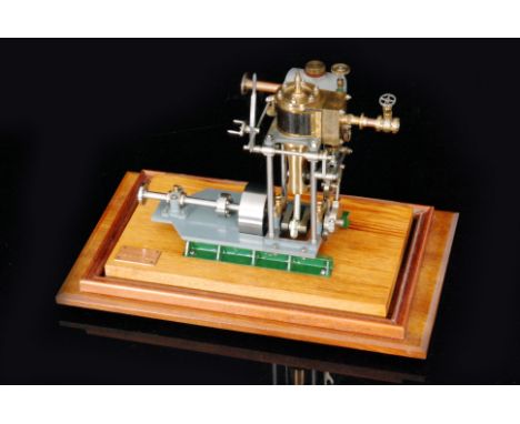 A late 20th Century scale model of a single oscillating piston beam engine made by E.E Hughes in a glass display case on maho