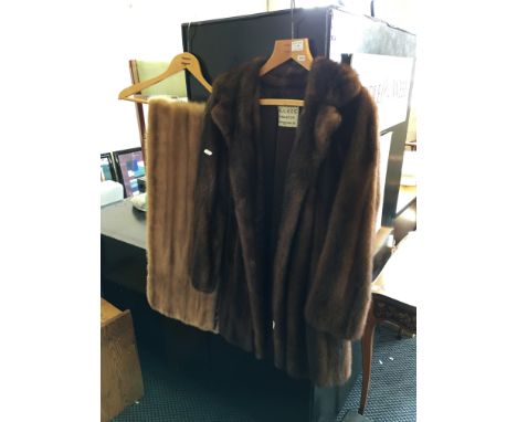 A Faulkes brown fur coat together with a light coloured fur scarf.