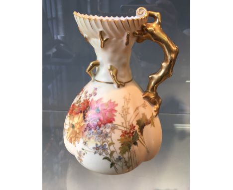 An early 20th Century Royal Worcester blush ware jug with floral pattern body with gilt coloured rustic handle, numbered to b