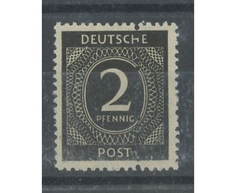 1946 2pf black numeral with extra vertical perf through centre of stamp. U/M, fine. SG 900 var.