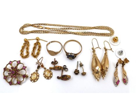 A group of 9ct gold and yellow metal jewellery, including a ruby set brooch, a ring set with blue and white stones, two pairs