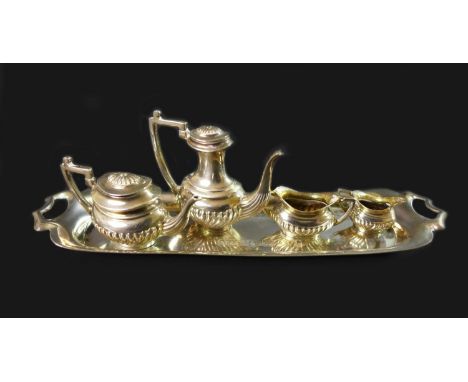 An Elizabeth II silver miniature tea and coffee service, comprising a teapot with lid, 5.3 by 2.2 by 3cm high, a coffee pot w