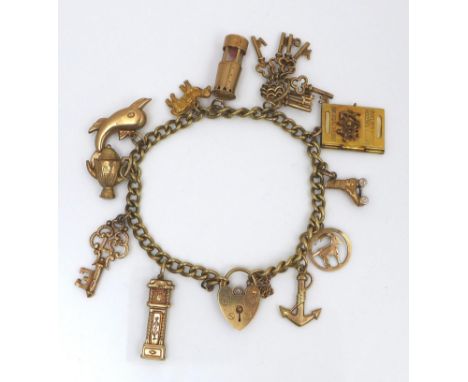 A 9ct gold charm bracelet, fitted with eleven 9ct gold charms and heart padlock clasp, comprising anchor, circular pendant wi