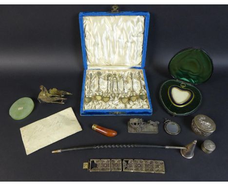 A group of silver and collectables, including a cased set of six spoons and matching tongs with heraldic cast terminals, the 