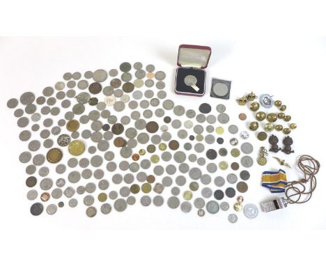 A collection of post 1946 coinage and militaria, including four British army badges including Royal Fusiliers, an RAF enamel 